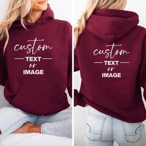 May include: Burgundy hoodie with a white print that says "custom text or image" on the front and back.