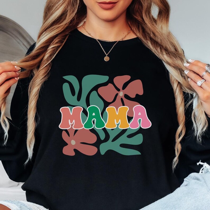 Mama shirt with retro floral graphic design and colorful lettering, cute mom t shirt for women, soft cotton tee perfect for everyday wear, casual outfits, and family time, stylish and comfortable mom apparel ideal for gifting