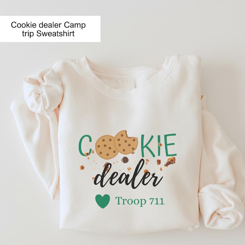 Girl Scout cookie dealer crewneck with fun cookie design and troop customization. Comfortable sweatshirt ideal for scouts, scout moms, and cookie selling activities.