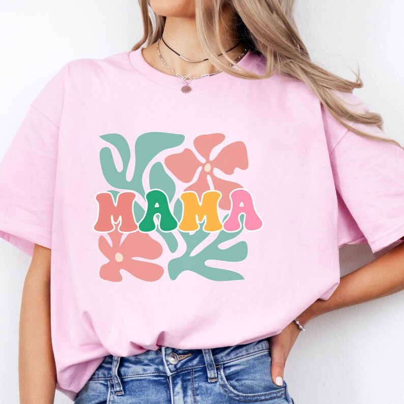 Vintage mama shirt with colorful floral illustration, cute mom graphic tee for women, comfortable cotton fabric ideal for everyday wear, casual outfits, and gifting for birthdays or Mother’s Day.