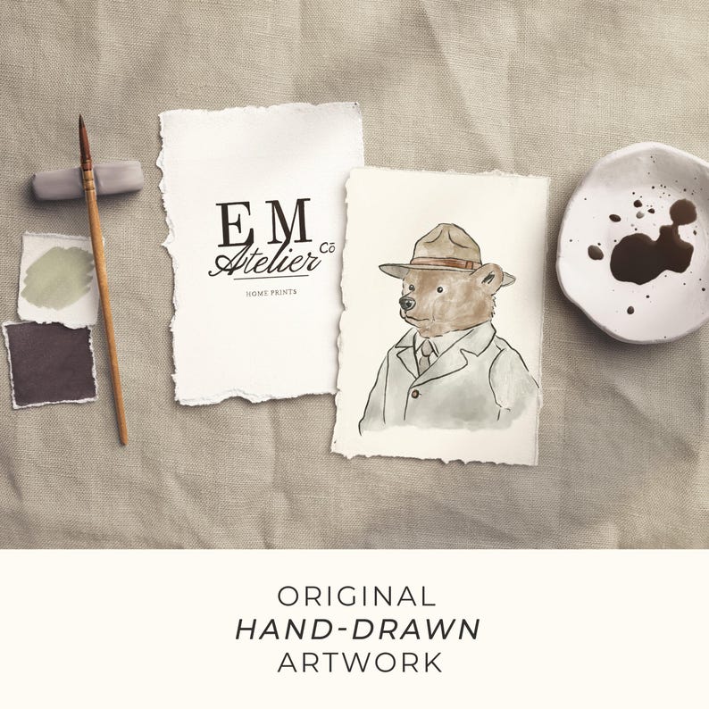 May include: Original hand-drawn artwork featuring a watercolor illustration of a bear in a hat and coat. The image includes a logo, paint swatches, a paintbrush, and a small dish with paint.