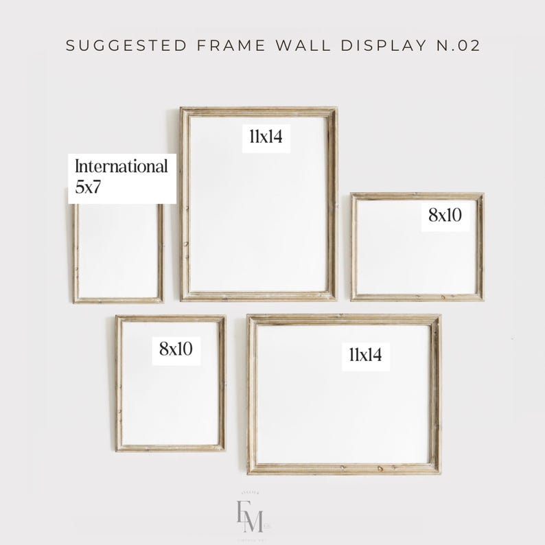 May include: A suggested frame wall display with five frames in various sizes. The frames are arranged in a staggered pattern. The frames are all white and have a light wood finish. The frames are labeled with their dimensions: 11x14, 8x10, 5x7, 11x14, and 8x10.