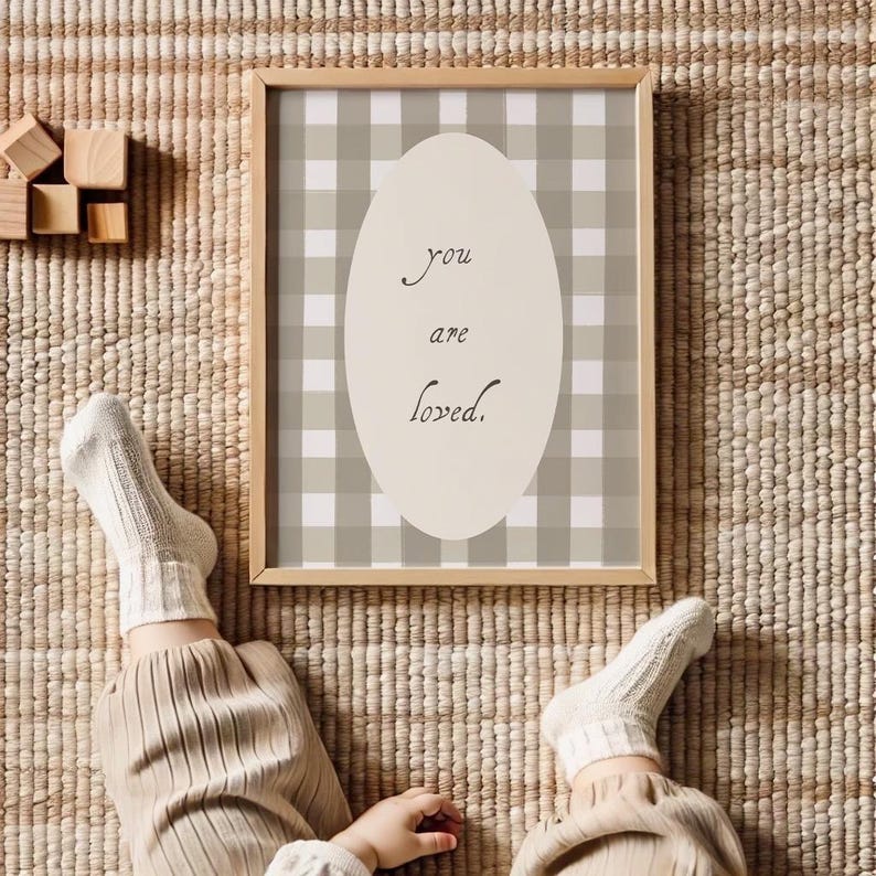 Soft green nursery decor celebrating love and family bonds