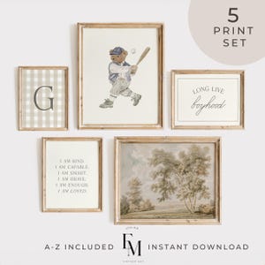 May include: A five-piece print set featuring framed art prints. The prints include a gingham letter, a bear playing baseball, a landscape, and inspirational quotes. The set is in neutral tones with wooden frames. Text on the image reads "5 PRINT SET" and "A-Z INCLUDED".