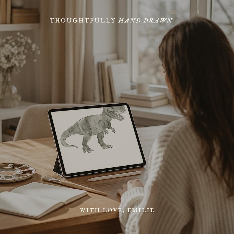 May include: A digital illustration of a Tyrannosaurus Rex displayed on a tablet. The tablet is on a wooden desk with art supplies and the text "THOUGHTFULLY HAND DRAWN" and "WITH LOVE, EMILIE".