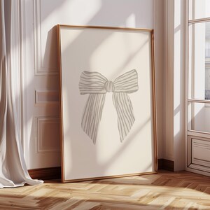 Vintage-style girl nursery print featuring a beautifully drawn pink bow.