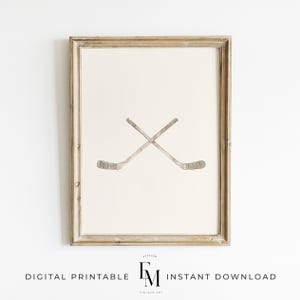 Neutral hockey wall art featuring a vintage hockey stick for charming boys' decor