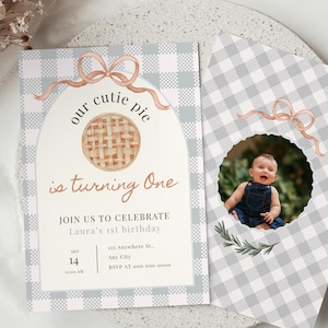 May include: A two-part birthday invitation set with a gingham pattern in gray and white. The main invitation features the text "our cutie pie is turning One" and a watercolor pie illustration. The second card has a photo of a baby.
