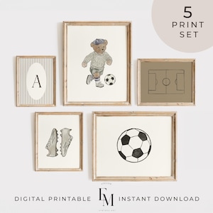 May include: A set of five framed prints with a soccer theme. The prints include a soccer ball, soccer cleats, a soccer field, and a teddy bear playing soccer. The text "5 PRINT SET" is in a circle at the top right. The text "DIGITAL PRINTABLE" and "INSTANT DOWNLOAD" are at the bottom.