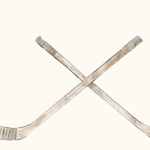 May include: Two wooden hockey sticks crossed over each other. The sticks are brown with a light brown wrap at the top.