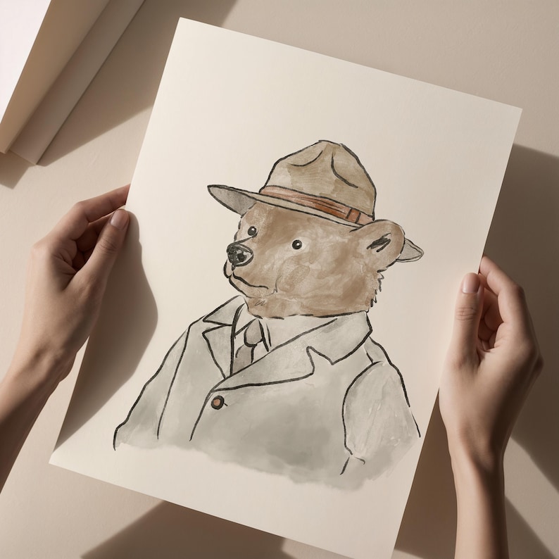 May include: Watercolor illustration of a bear wearing a fedora hat, a suit jacket, and a tie. The bear's fur is brown, and the hat is tan with a brown band. The artwork is on a cream-colored paper.