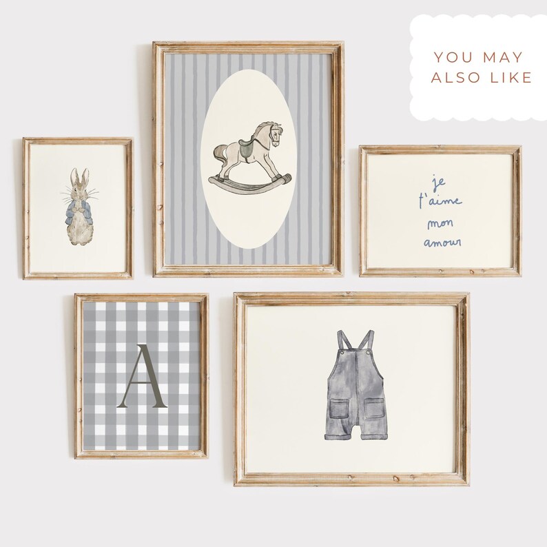 May include: A collection of framed art prints with a nursery theme. The prints feature a rocking horse, a bunny, a gingham pattern with the letter "A", overalls, and the text "je t'aime mon amour". The frames are wooden.