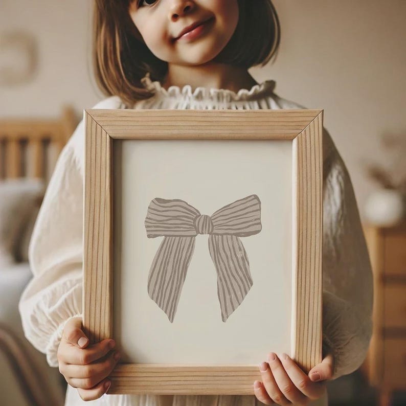 Timeless pink ribbon illustration to add a sweet touch to your baby girl’s decor.