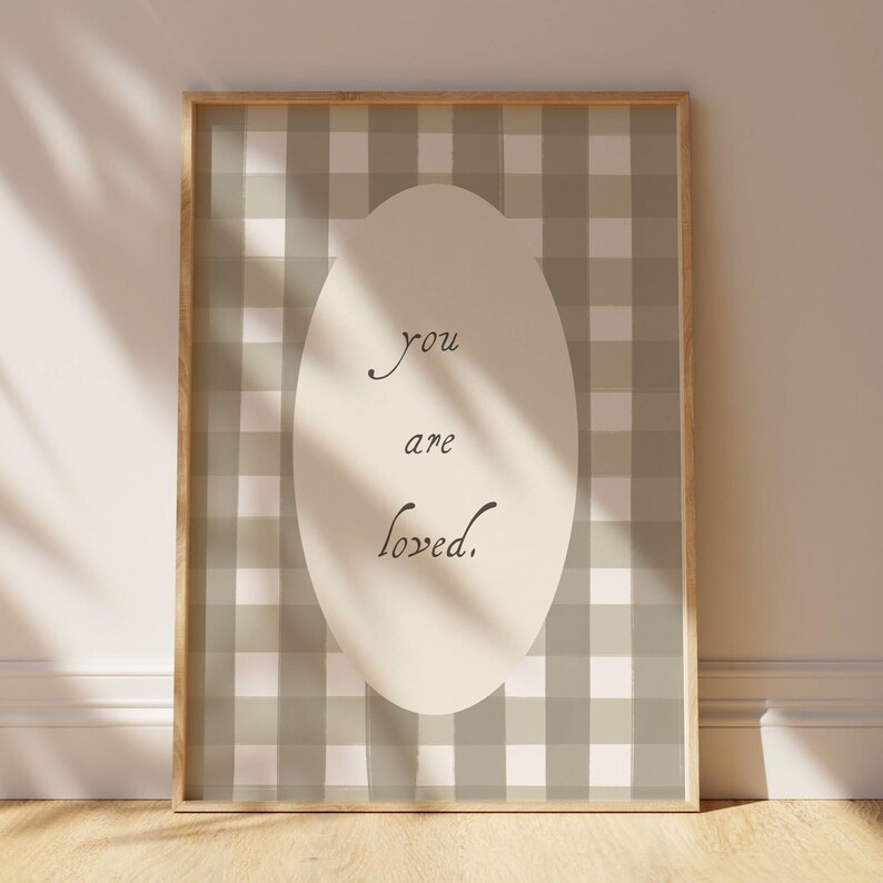 Gender neutral wall art with love quote and gingham pattern