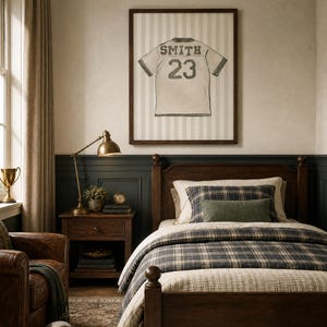 May include: A bedroom scene featuring a wooden bed with plaid bedding, a framed jersey print, and a leather armchair. The jersey print displays the name "SMITH" and the number "23". A soccer ball rests on the floor.