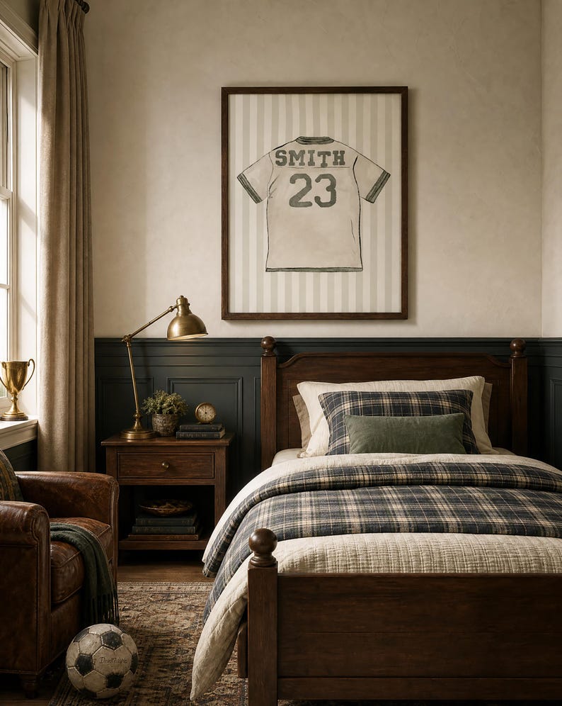 May include: A bedroom scene featuring a wooden bed with plaid bedding, a framed jersey print, and a leather armchair. The jersey print displays the name "SMITH" and the number "23". A soccer ball rests on the floor.
