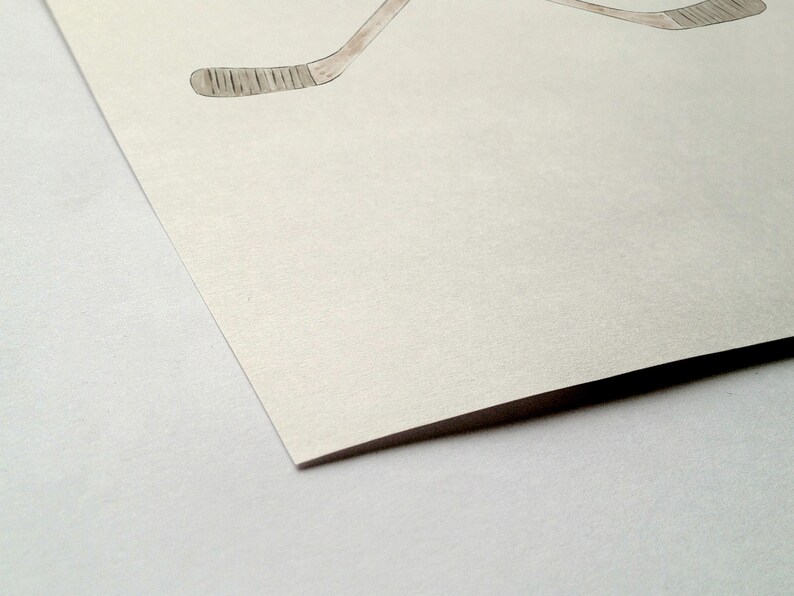 May include: A blank white card with a textured surface. The card is folded in half and the edge is visible.