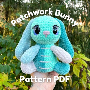 May include: A handmade turquoise and blue patchwork bunny plushie with large, expressive eyes and a pink nose. The bunny has long, floppy ears and is made of soft, textured fabric. Text on the image reads "Patchwork Bunny Pattern PDF".