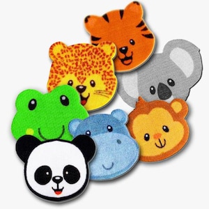 Peut inclure: Ensemble de sept appliques en feutre d'animaux colorés, comprenant un tigre, un léopard, une grenouille, un hippopotame, un singe, un koala et un panda. Chaque applique a un visage amical et est parfaite pour les projets d'artisanat.