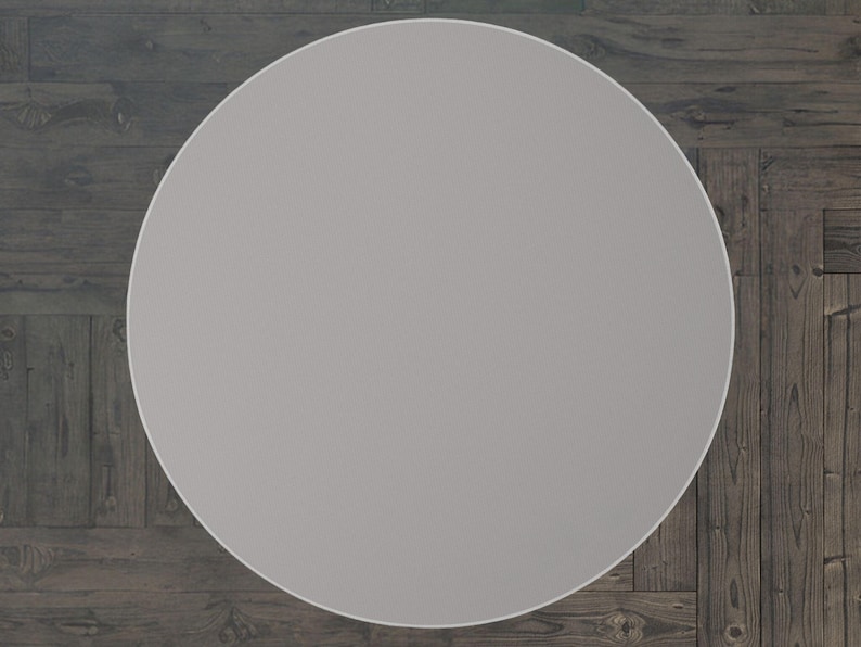 May include: A plain, light grey round table top.