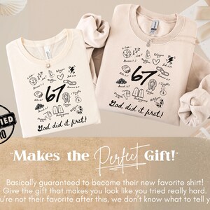 May include: Two off-white sweatshirts with black graphic designs, including the number "67" and the phrase "God did it first!" The shirts have crew necks and long sleeves. The image includes gift boxes and decorative paper fans.
