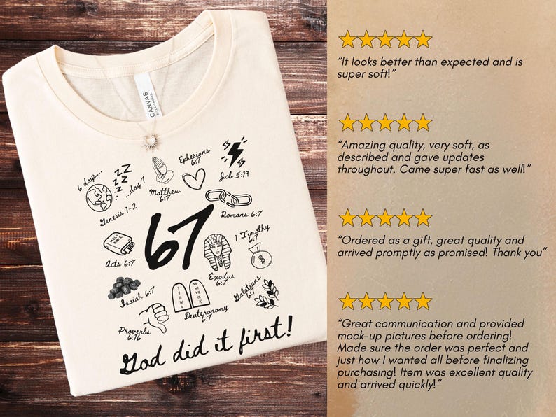 May include: Cream-colored t-shirt with a round neckline, featuring black graphic illustrations and the text "67 God did it first!". The design includes religious symbols and references to biblical verses. A silver necklace with a pendant is visible.