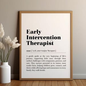 May include: A black and white printable definition of "Early Intervention Therapist" with a simple, modern design. The definition describes the role of an early intervention therapist as a guide for young children.