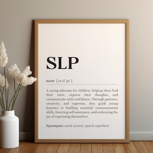 May include: Black and white printable poster with the definition of "SLP" as a noun. The definition describes an SLP as a caring advocate for children, helping them find their voice, express their thoughts, and communicate with confidence. The poster also lists synonyms for SLP, which are "word wizard" and "speech superhero".
