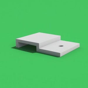 May include: A white, stepped platform with a rectangular base and a smaller, elevated section. The platform has a hole in the top surface. The background is a solid green colour.