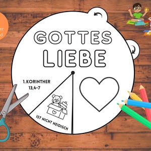 May include: A printable colouring page with a circle divided into sections. The circle has the text "GOTTES LIEBE" at the top. One section has the text "1.KORINTHER 13,4-7" and the text "IST NICHT NEIDISCH" below it. Another section has a heart shape. A teddy bear is in a box in the third section.