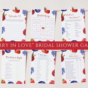 May include: Six bridal shower game cards with berry illustrations. The cards include games like "Who Am I?", "Bridal Bingo", and "What's in Your Purse?" The phrase "Berry in Love" is displayed on a red banner.