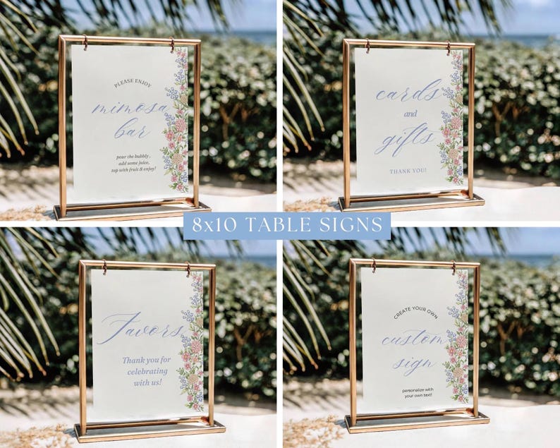 May include: Four 8x10 table signs with gold frames. Each sign has a white background with text and floral accents. The signs read "Mimosa Bar", "Cards and Gifts", "Favors", and "Create Your Own Custom Sign".