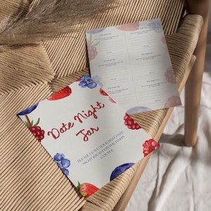 May include: Two sheets of paper with a watercolor design of berries and the words "Date Night Jar" in red script. The design includes strawberries, blueberries, and raspberries. One sheet has lines for writing date night ideas.