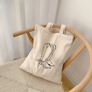 Bolsa tote de lona de algodão com botas de cowboy: design de rodeio ocidental