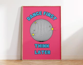 May include: A framed poster with a vibrant pink background. The poster features a disco ball graphic and the text "DANCE FIRST THINK LATER" in blue. The disco ball has a grid pattern with yellow starburst accents.
