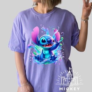 a woman wearing a purple shirt with a stitching stitch stitch stitch stitch stitch stitch