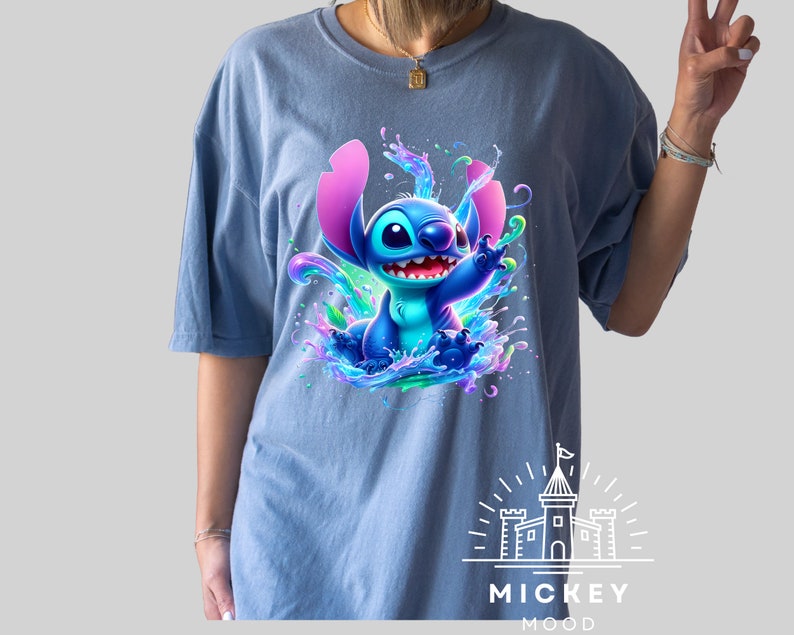a woman wearing a blue shirt with a stitch stitch stitch stitch stitch stitch stitch stitch