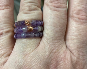 Handmade stackable rings in purple and gold colored beads