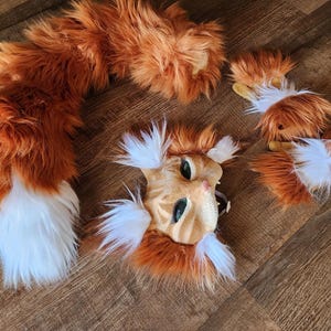 Custom made to order tails, paws, and mask!