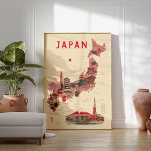 May include: A framed poster with the word "JAPAN" in red at the top. The poster features a map of Japan with illustrations of landmarks in red and pink. A large potted plant, a gray ottoman, and decorative vases are in front of a white wall.