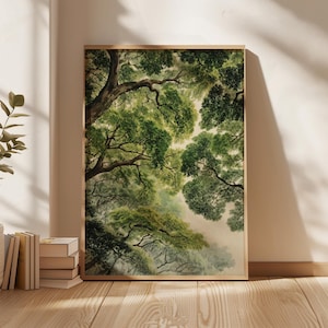 May include: A framed art print featuring a watercolor painting of a forest canopy. The artwork showcases a view looking up through the trees, with lush green foliage and branches. The frame is a light wood color, and the print is displayed on a wall.