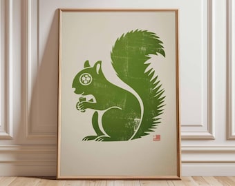 May include: A framed print featuring a green squirrel illustration. The squirrel is holding a nut and has a textured, distressed appearance. The artwork is set against a cream background and framed in wood.