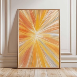 Peut inclure: Impression d'art abstrait dans un cadre en bois. L'œuvre présente une explosion de couleurs rayonnant du centre, avec des teintes d'orange, de jaune et de blanc. La peinture est exposée contre un mur blanc et un sol en bois.