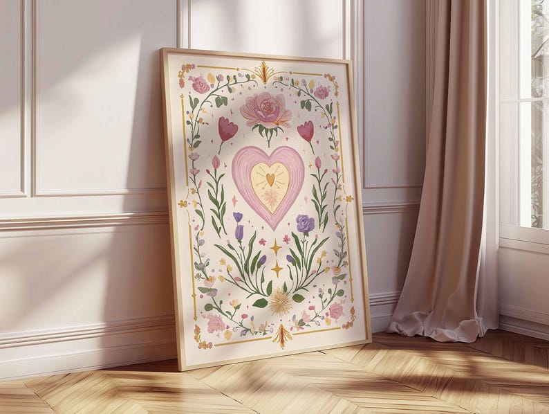 May include: A framed art print featuring a central heart design with a smaller heart inside, surrounded by floral elements in pink, purple, and green. The artwork is set against a cream background with a wooden frame.