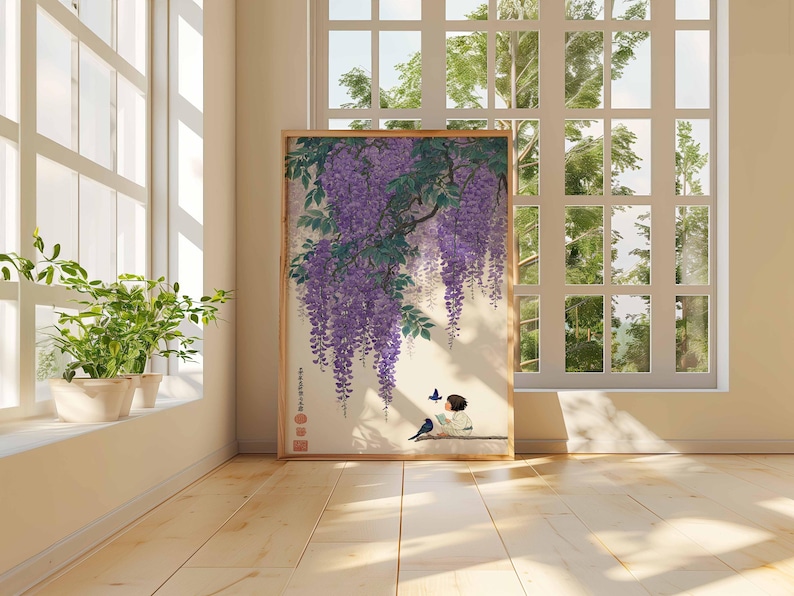 May include: A framed print of a Japanese-style painting featuring purple wisteria blossoms cascading down. A figure sits reading, with a bird and butterfly nearby. The artwork is displayed in a room with a window and plants.