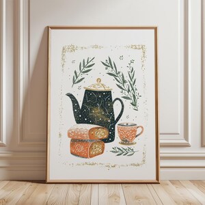 May include: A framed art print depicting a still life with a teapot, teacup, and pastries. The dark teal teapot has a celestial design, and the teacup and pastries are orange. Green leaves and gold accents surround the objects.