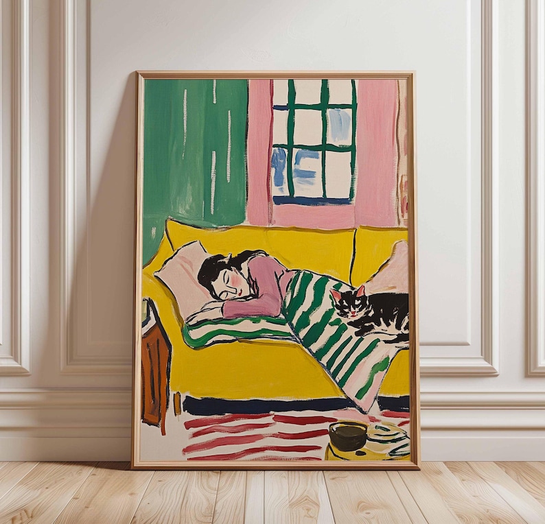 May include: A painting depicting a woman asleep on a yellow sofa with a black and white cat at her feet. The sofa is in a room with green and pink walls and a window with white blinds.