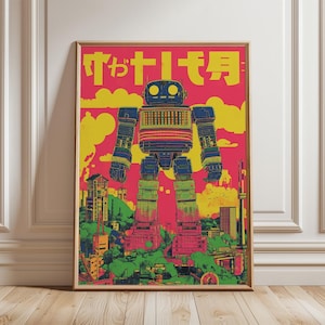 May include: A framed art print depicting a large robot in a cityscape. The robot is in blue, green, and red, set against a pink and yellow background. Japanese text is at the top. The print is in a wooden frame.