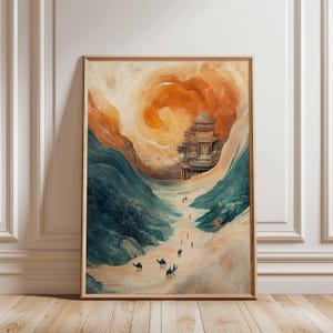 May include: Framed art print depicting a desert landscape with a traditional Asian pagoda. The artwork features a warm color palette of oranges, browns, and blues, with camels and figures traversing a sandy path. The pagoda is set against a swirling, cloud-like background.