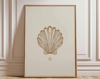 May include: A framed print featuring a gold-colored seashell illustration on a cream background. The seashell is the focal point, with detailed lines creating its shape. The print is in a wooden frame, leaning against a white wall and wooden floor.